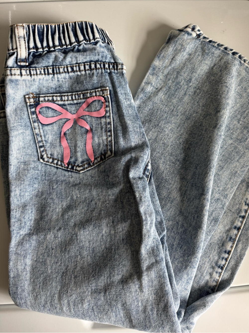 Girls Light Wash Jeans with Pink Bow Accent Size 8/10